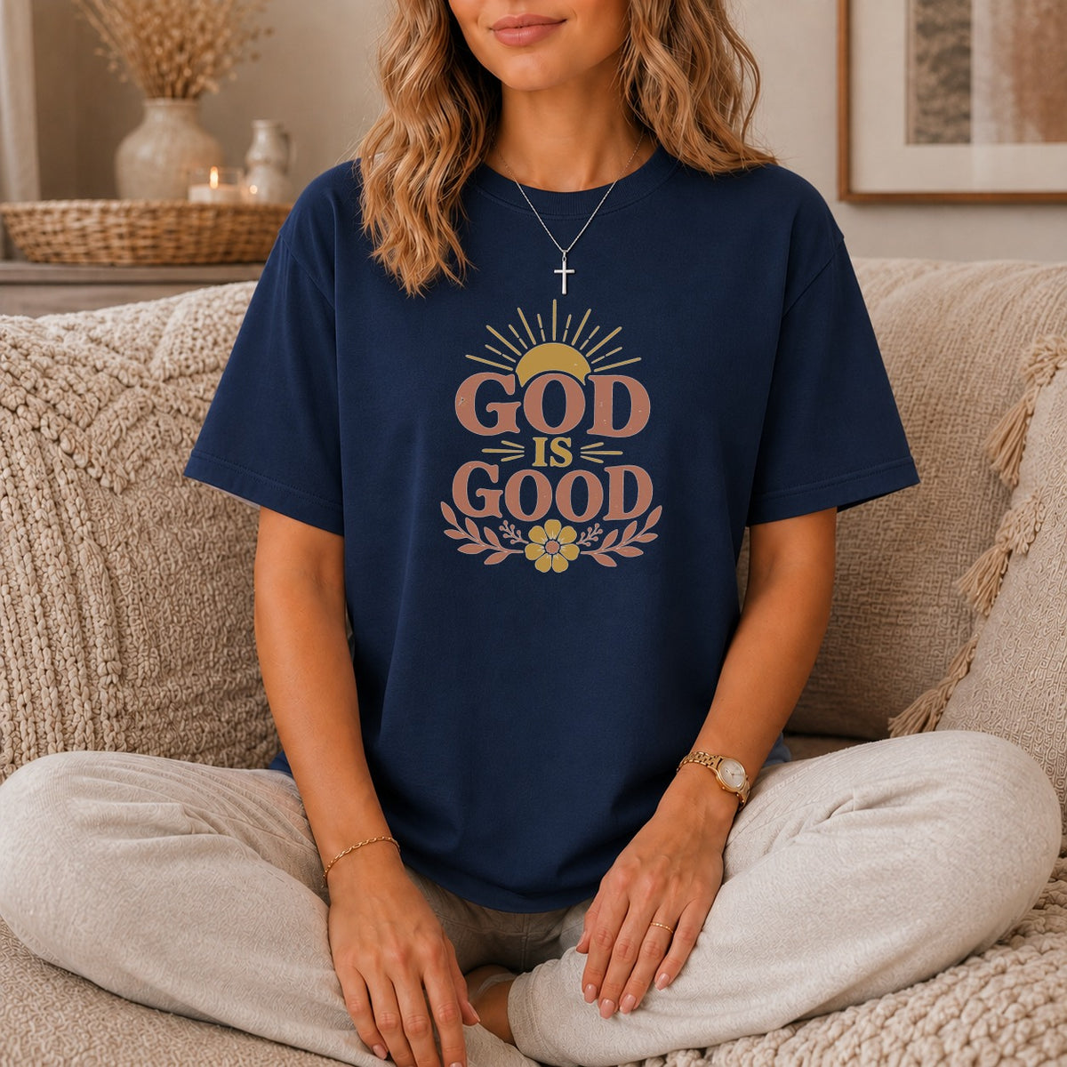 Navy t-shirt with "GOD IS GOOD" text and sun graphic.
