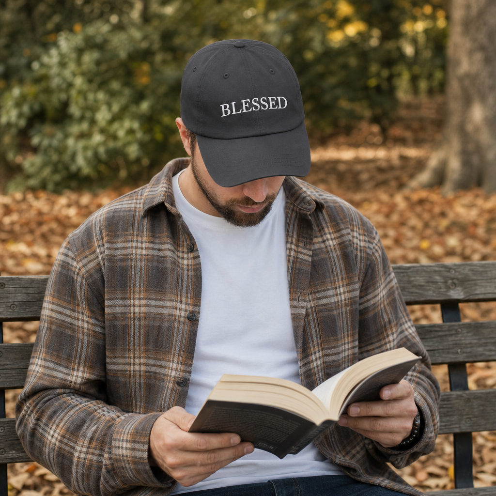 BLESSED embroidered Christian cap dark grey worn while reading outdoors -- thoughtful faith gift for dad | Nordenzi