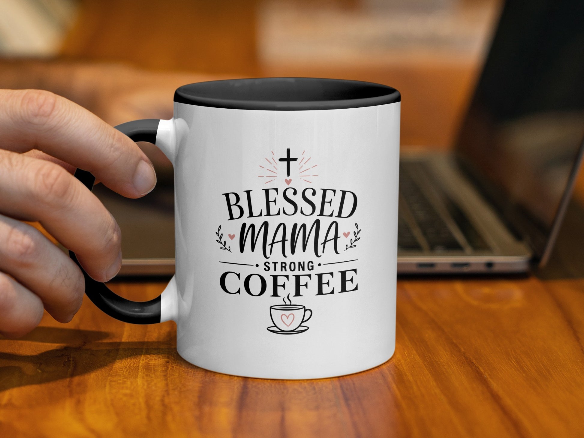 Mug with "Blessed Mama Strong Coffee" text, held by a hand.