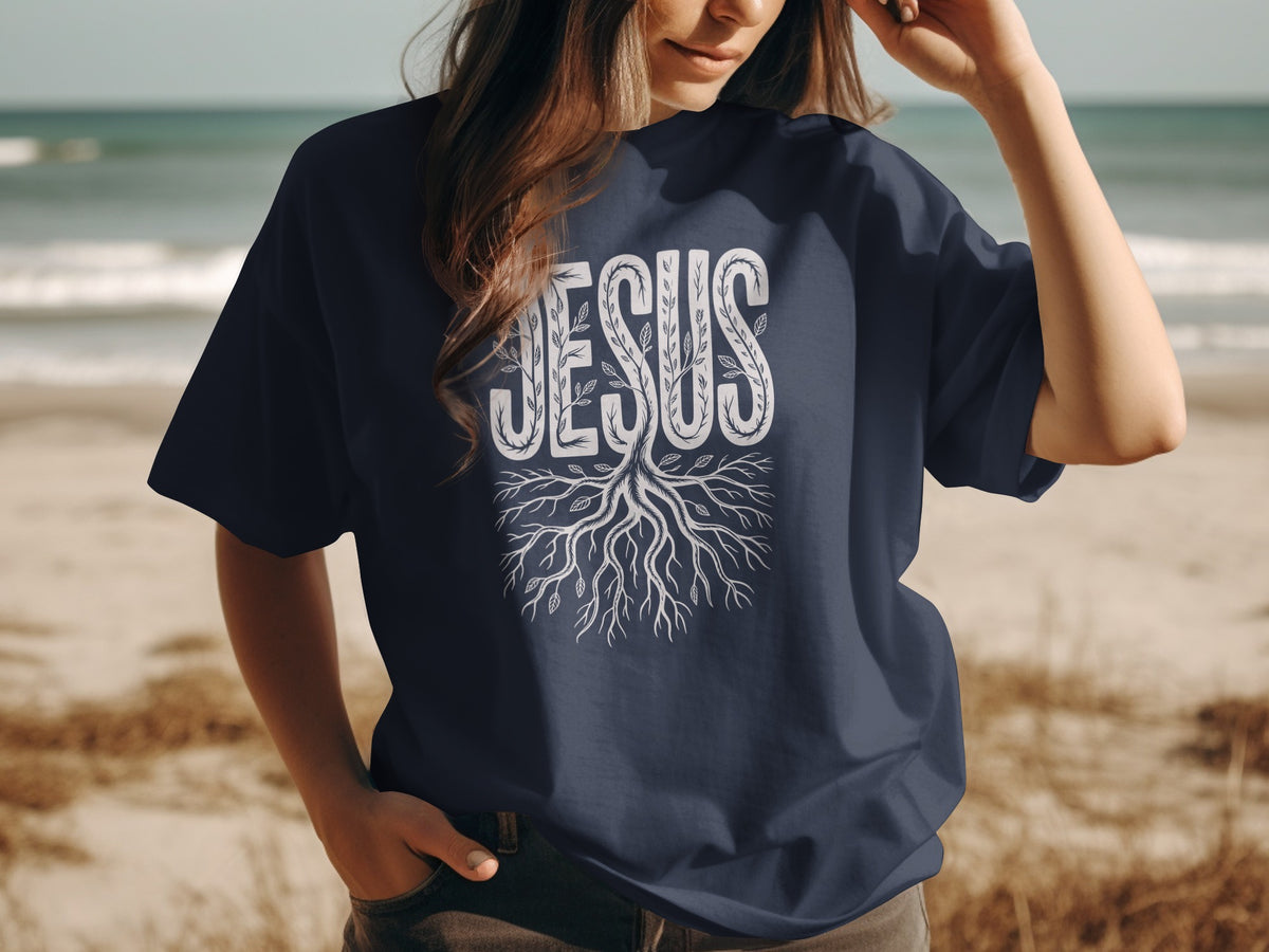 Dark blue t-shirt with white "JESUS" text and tree roots graphic.