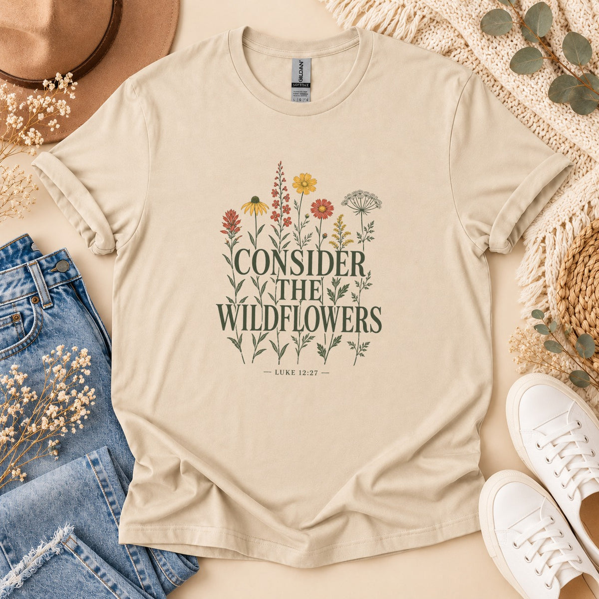 Cream t-shirt with "Consider the Wildflowers Luke 12:27" text and floral design.