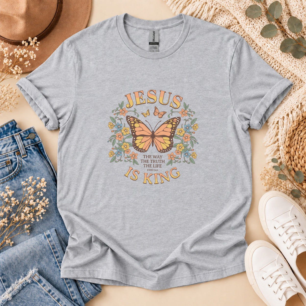 Grey t-shirt with Jesus Is King graphic, featuring a butterfly and floral design.