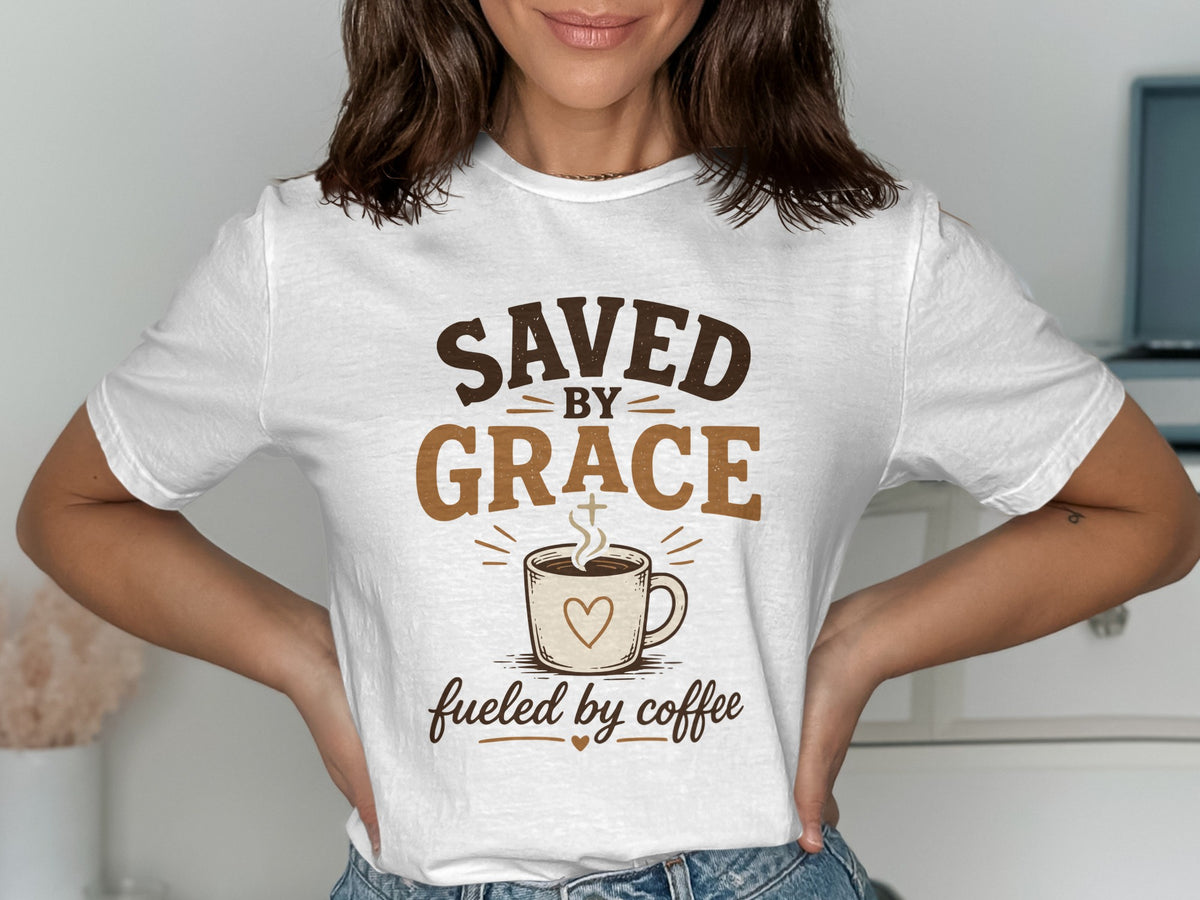 White t-shirt with "SAVED BY GRACE fueled by coffee" text and a coffee cup graphic.