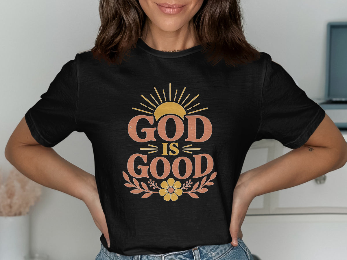 Black t-shirt with "GOD IS GOOD" text, sun, and floral design.