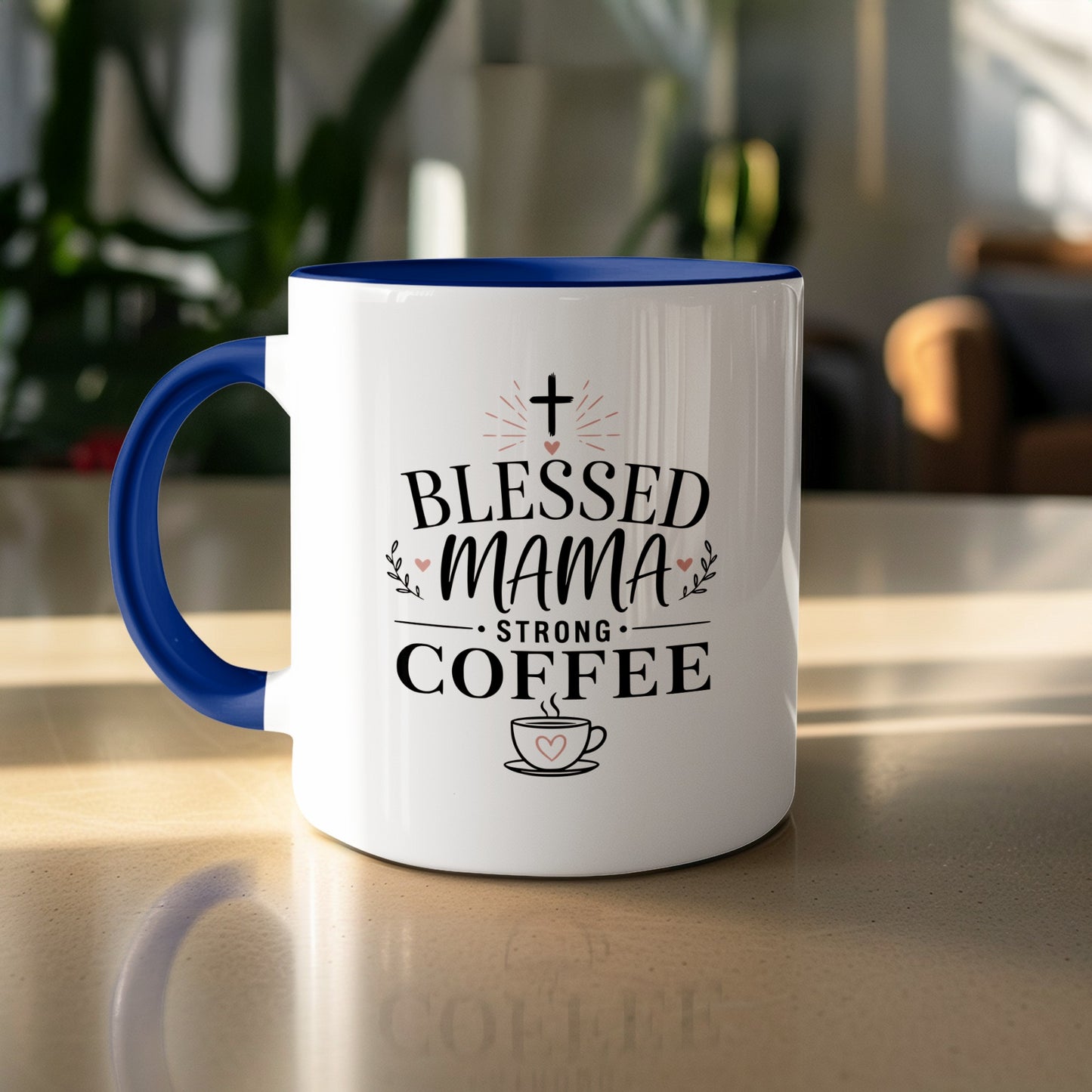 White mug with blue handle, "Blessed Mama Strong Coffee" text and heart graphic.
