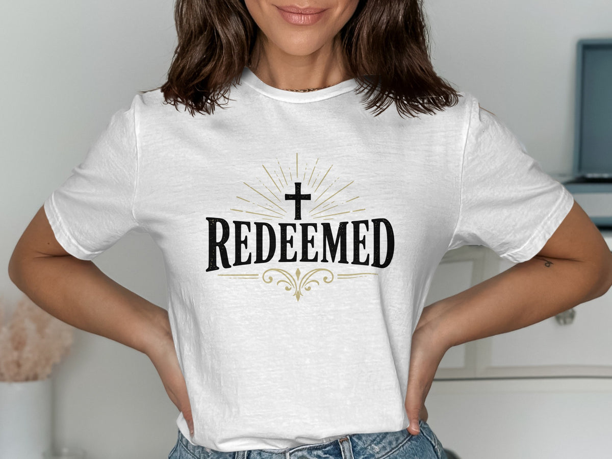 White t-shirt with "REDEEMED" and a cross design.