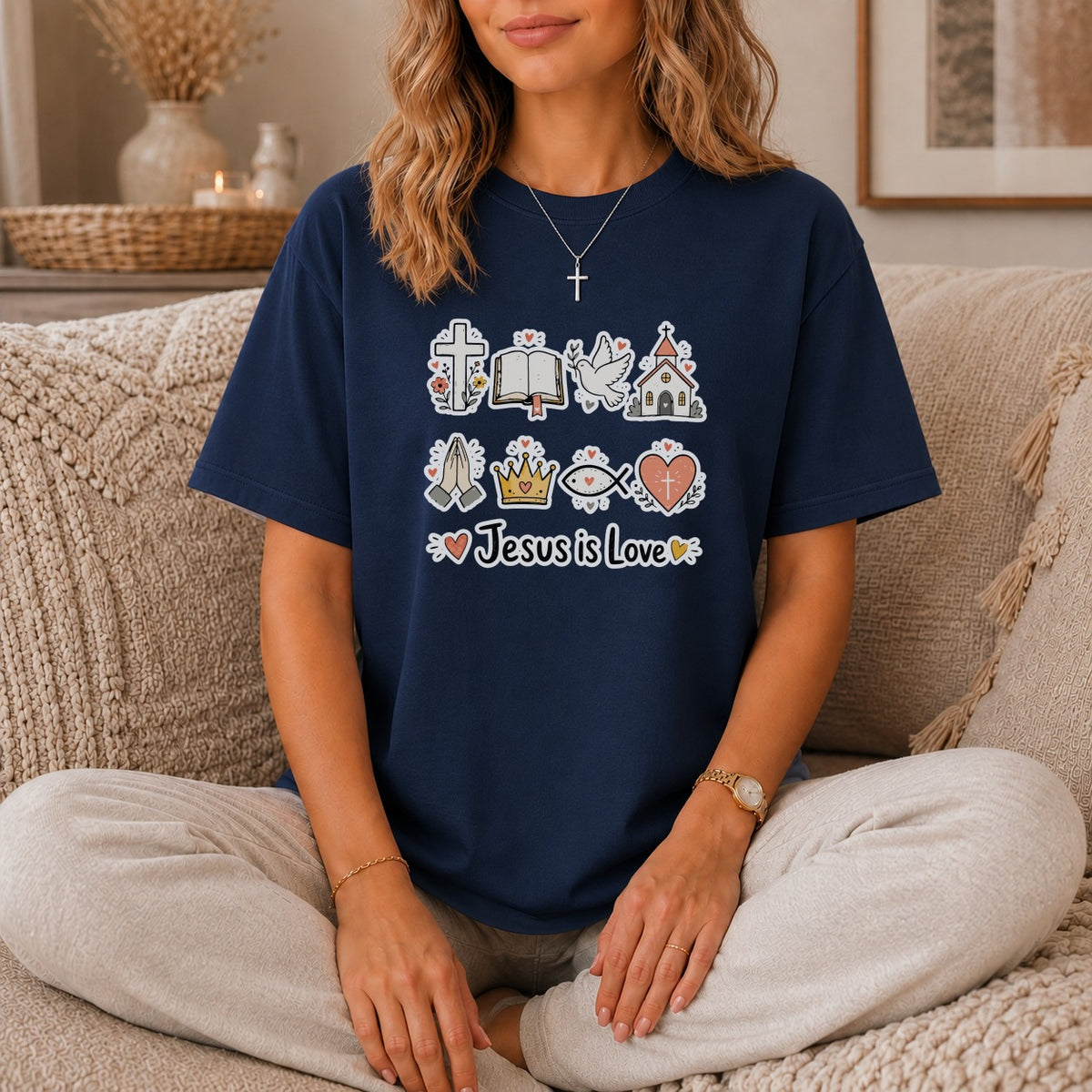 Navy t-shirt with Christian symbols and text "Jesus is Love".