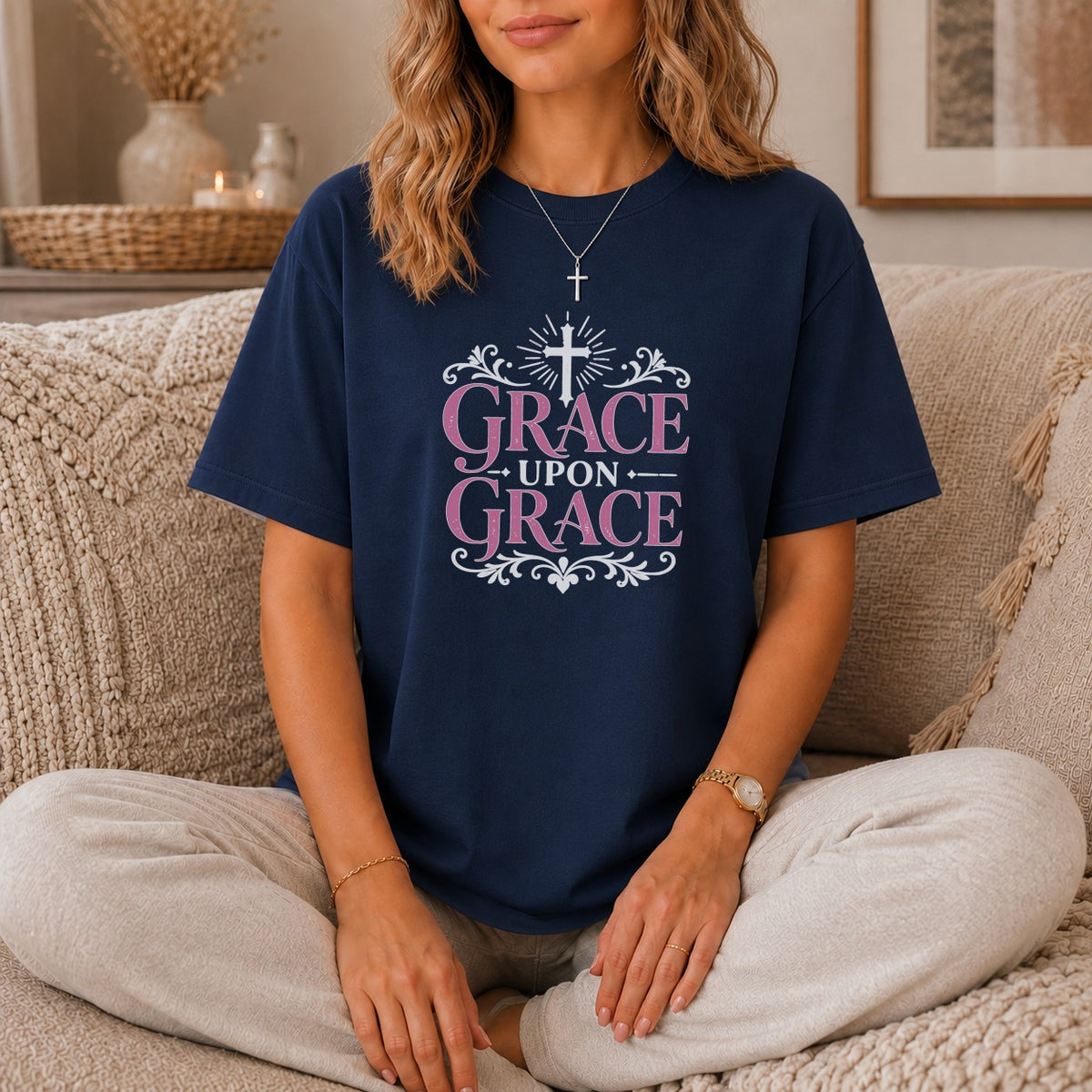 Navy t-shirt with pink text "GRACE UPON GRACE" and a cross.