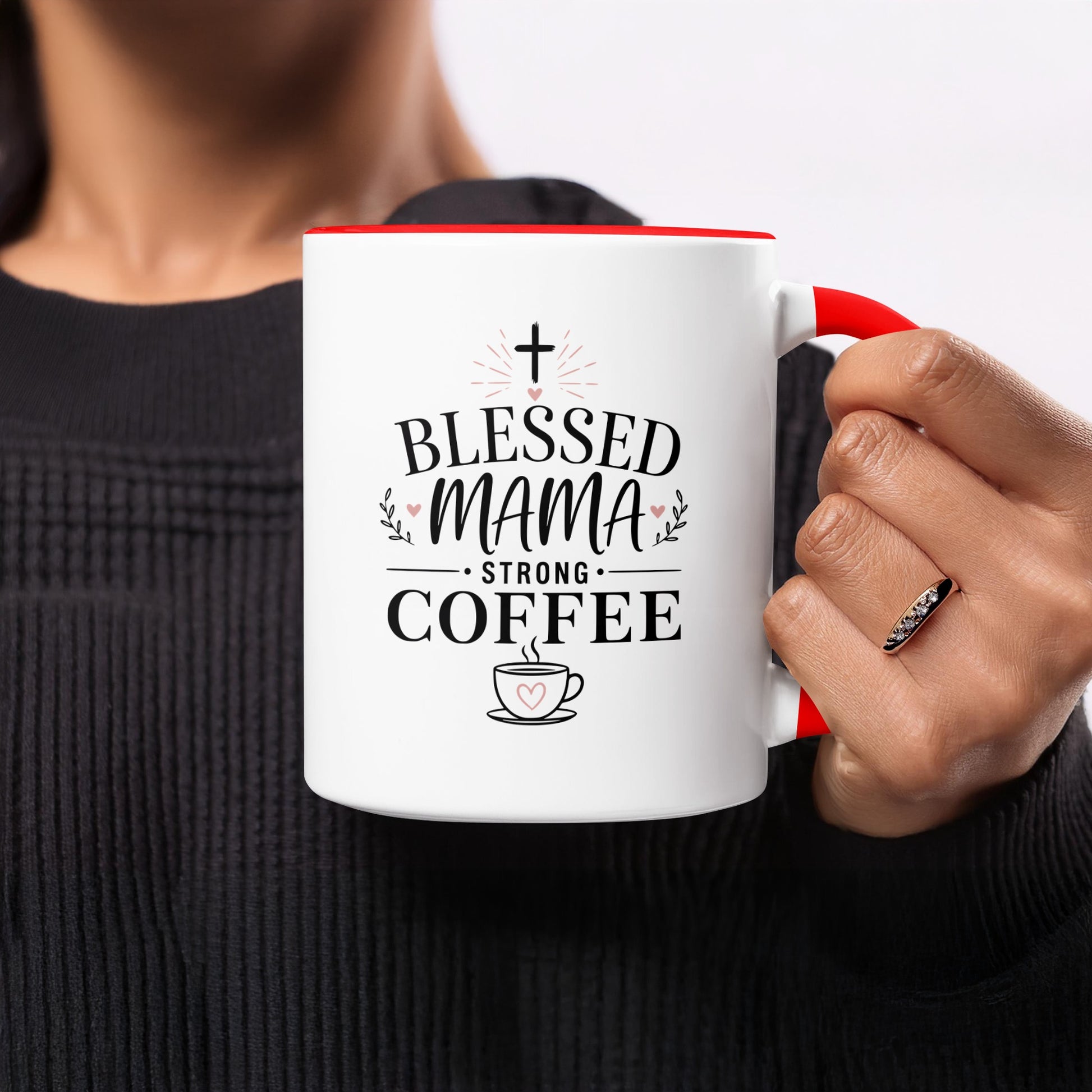 White mug with red handle and "Blessed Mama Strong Coffee" text.