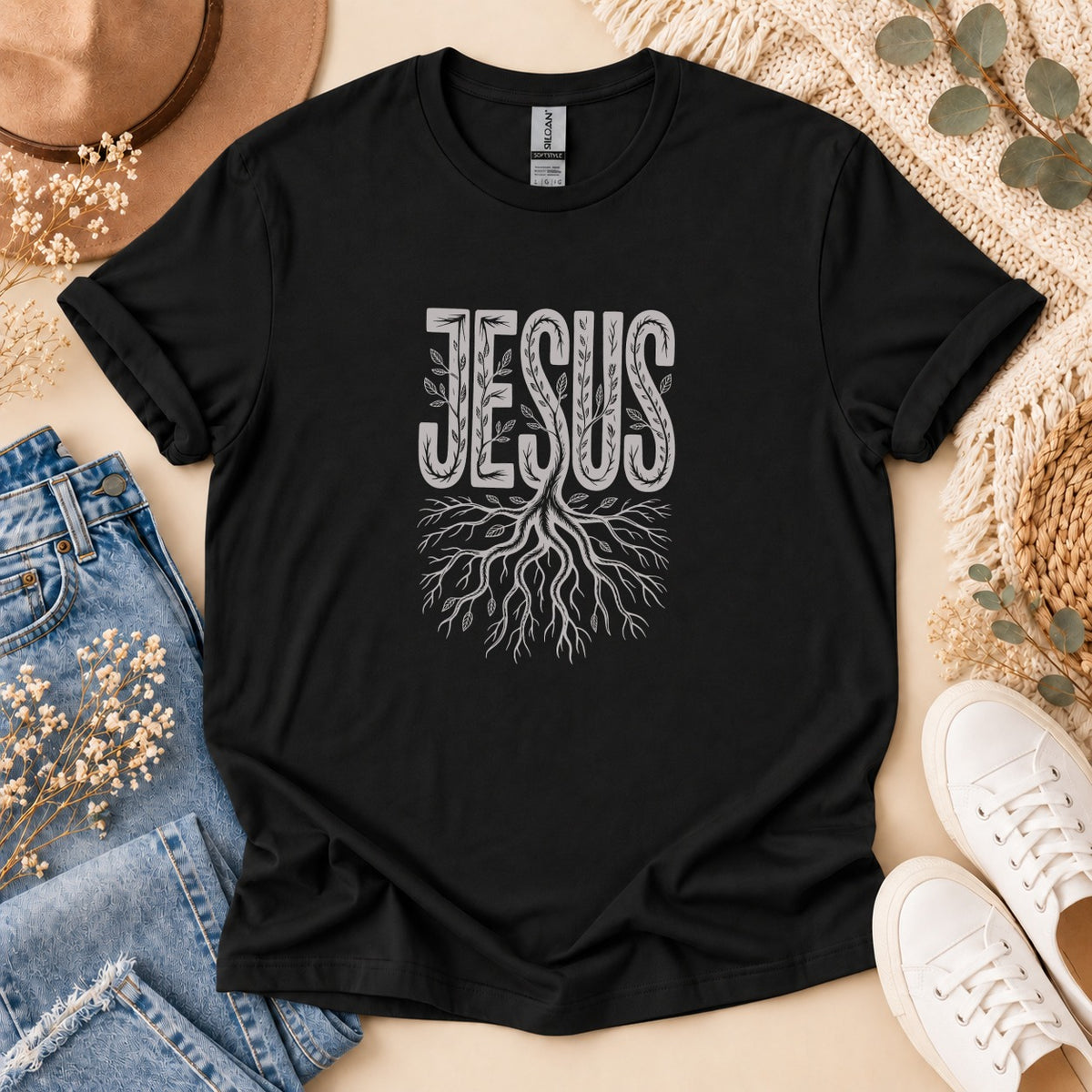 Black t-shirt with "JESUS" text and a tree root design.