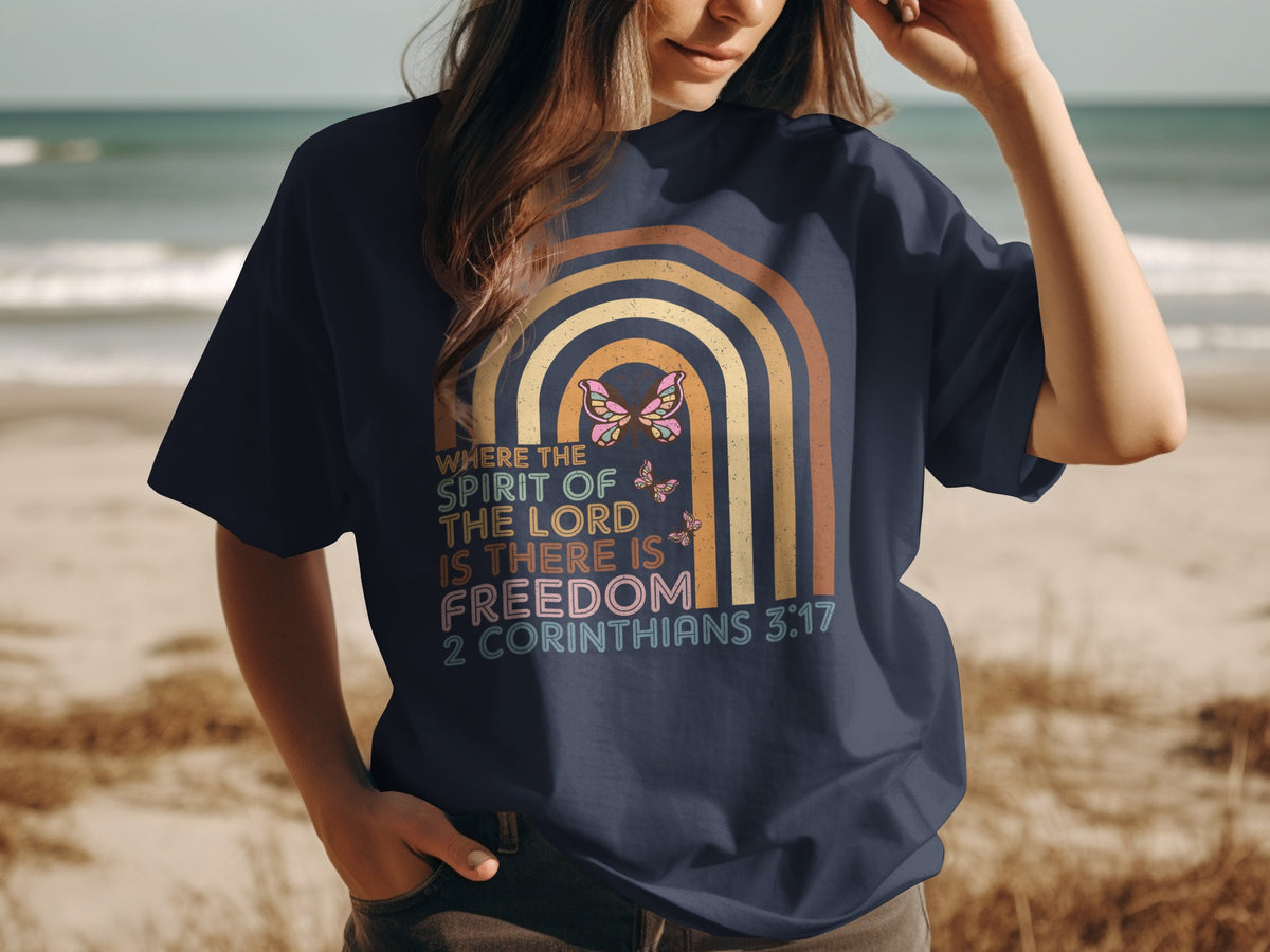 Navy t-shirt with retro rainbow and "Where the spirit of the Lord is there is freedom 2 Corinthians 3:17".