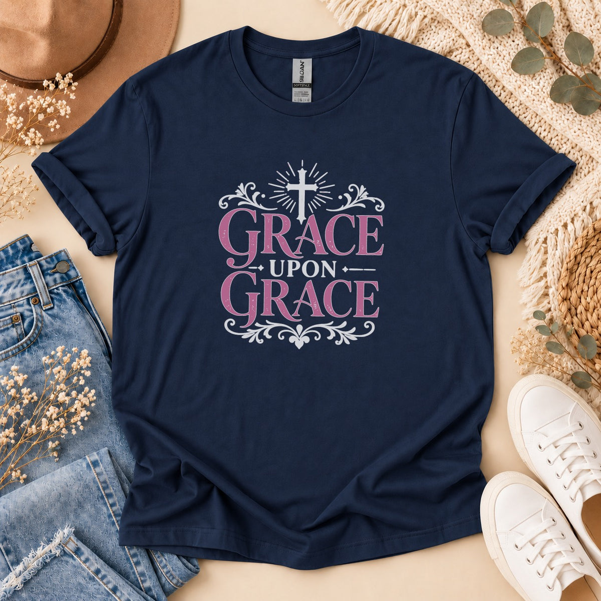 Navy t-shirt with white and pink "Grace Upon Grace" text and a cross.