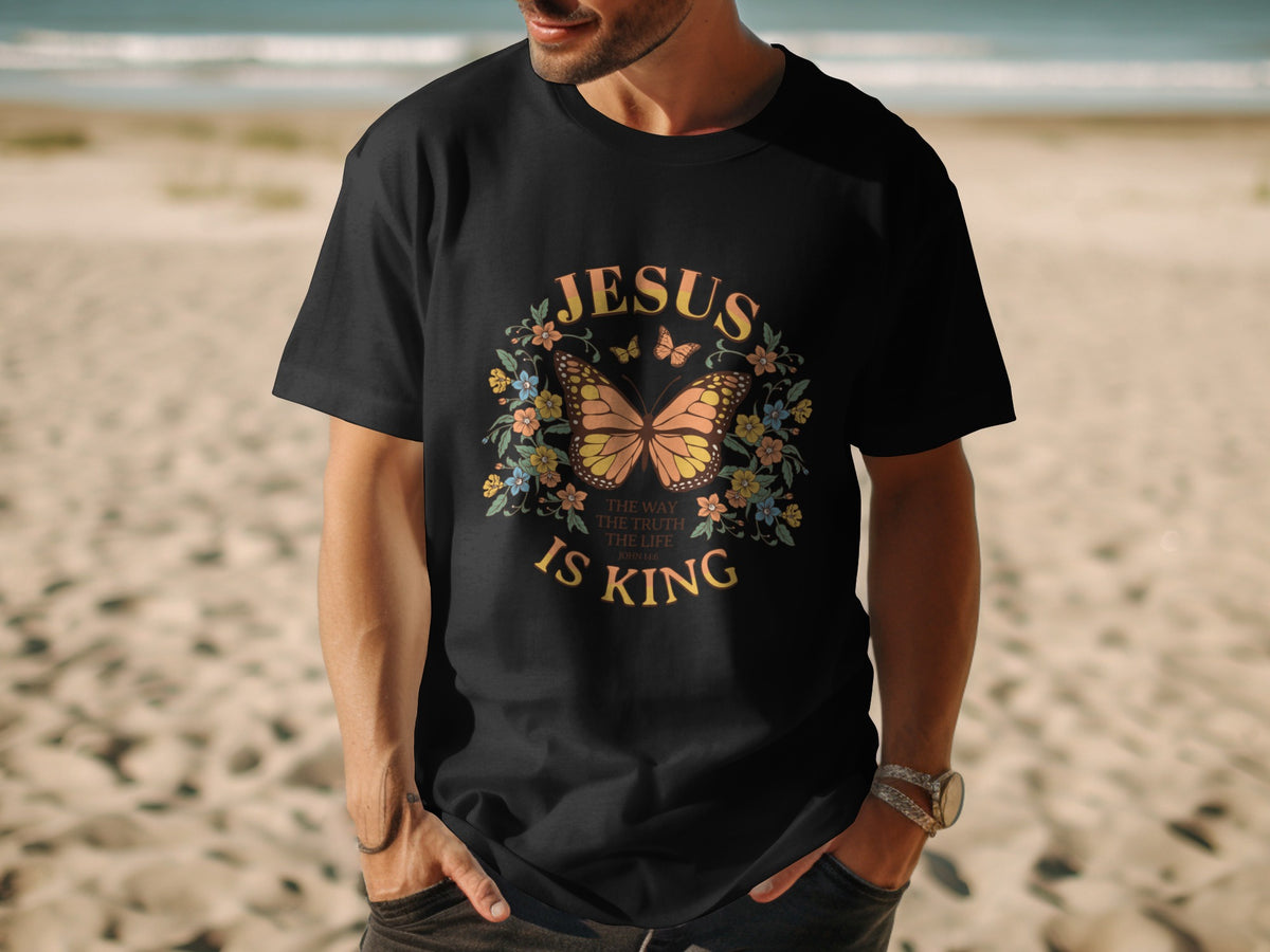 Black t-shirt with butterfly, flowers, and "Jesus is King" text.
