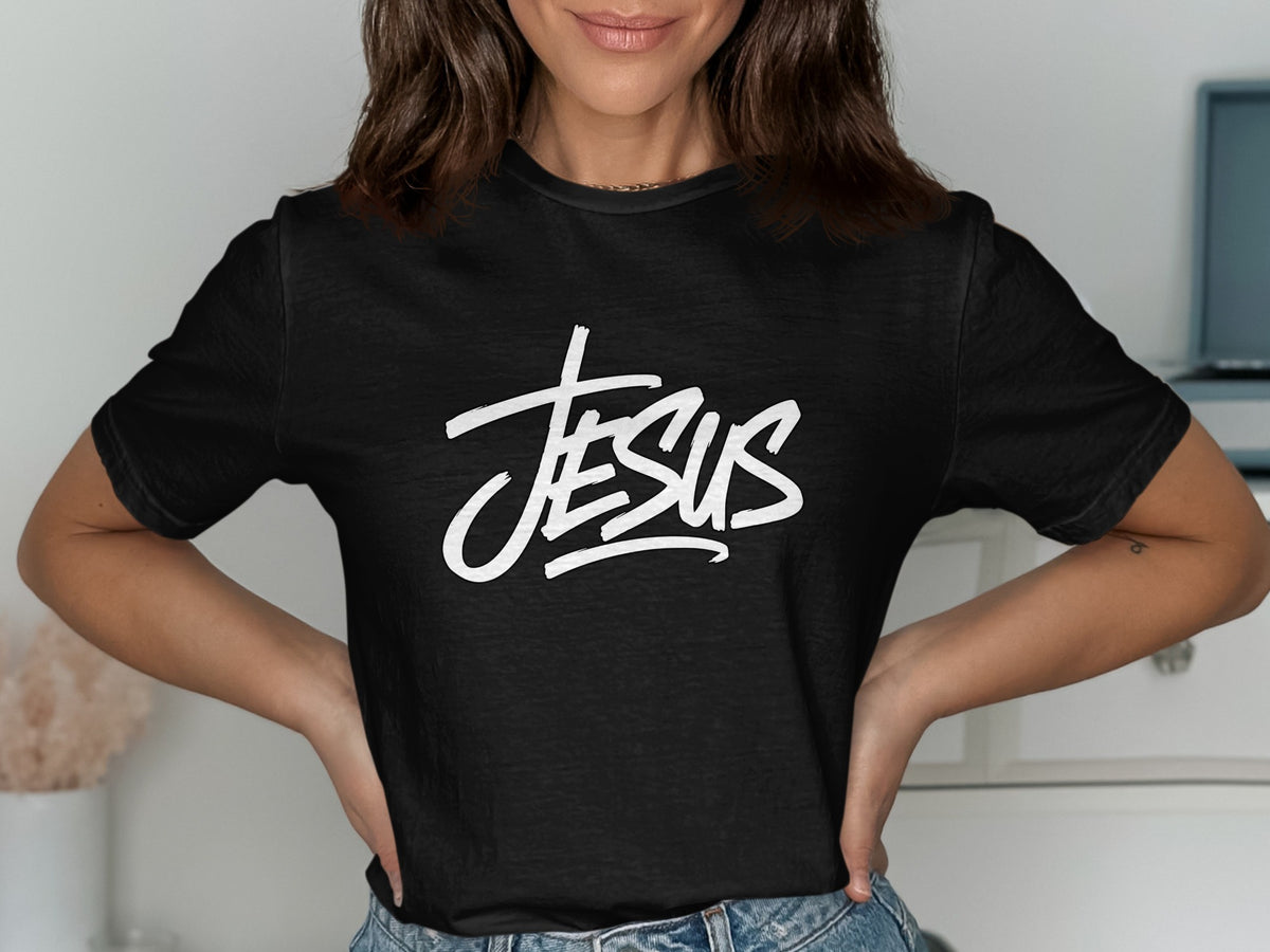 Black t-shirt with white "JESUS" text in a stylized font.