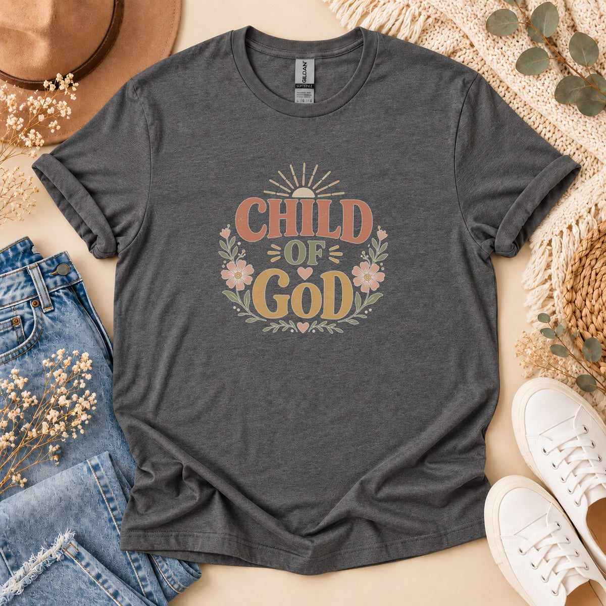 Charcoal t-shirt with "Child of God" text and floral wreath graphic.