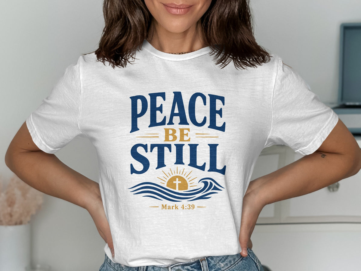 White t-shirt with "PEACE BE STILL" and Mark 4:39 scripture.